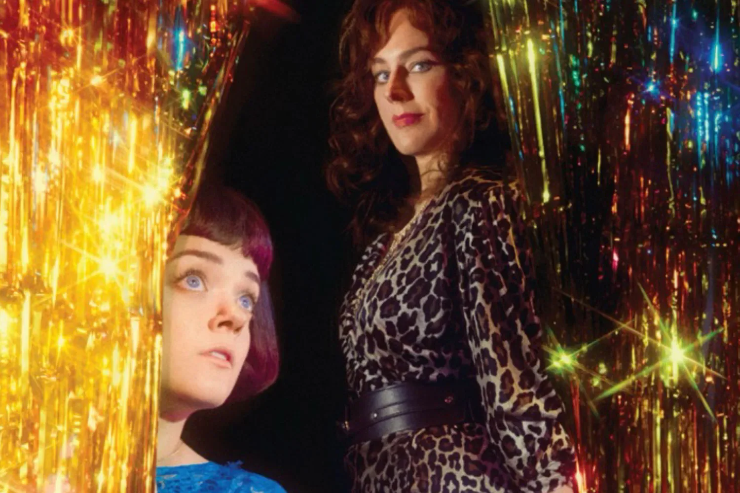 Francesca Mills as Little Voice and Jill Halfpenny as Mari Hoff in National Theatre promotional imagery for The Rise and Fall of Little Voice